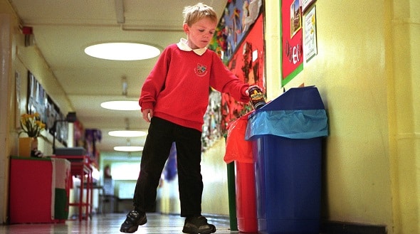 Boy recycling at school Boy recycling at school